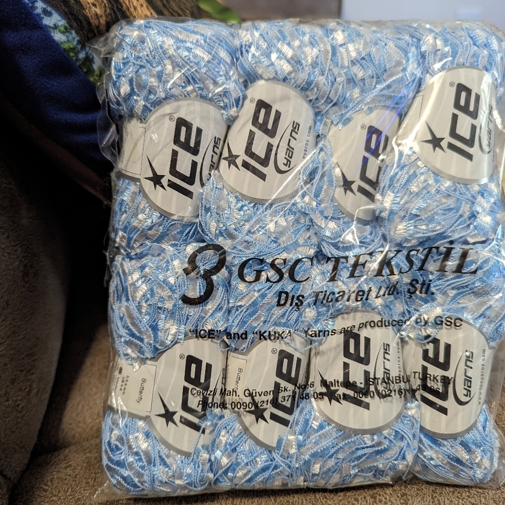 8 skeins of blue acrylic eyelash yarn/new without tags